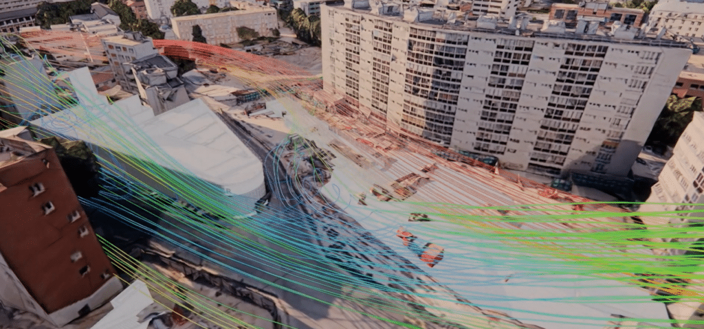 CFD simulation – air current lines superimposed on an external aerial view of the Issy RER station construction site, with surrounding residential buildings